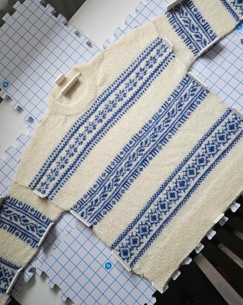 Porcelain Sweater in blue and cream Fair Isle colorwork, handmade knitted jumper on blocking mats